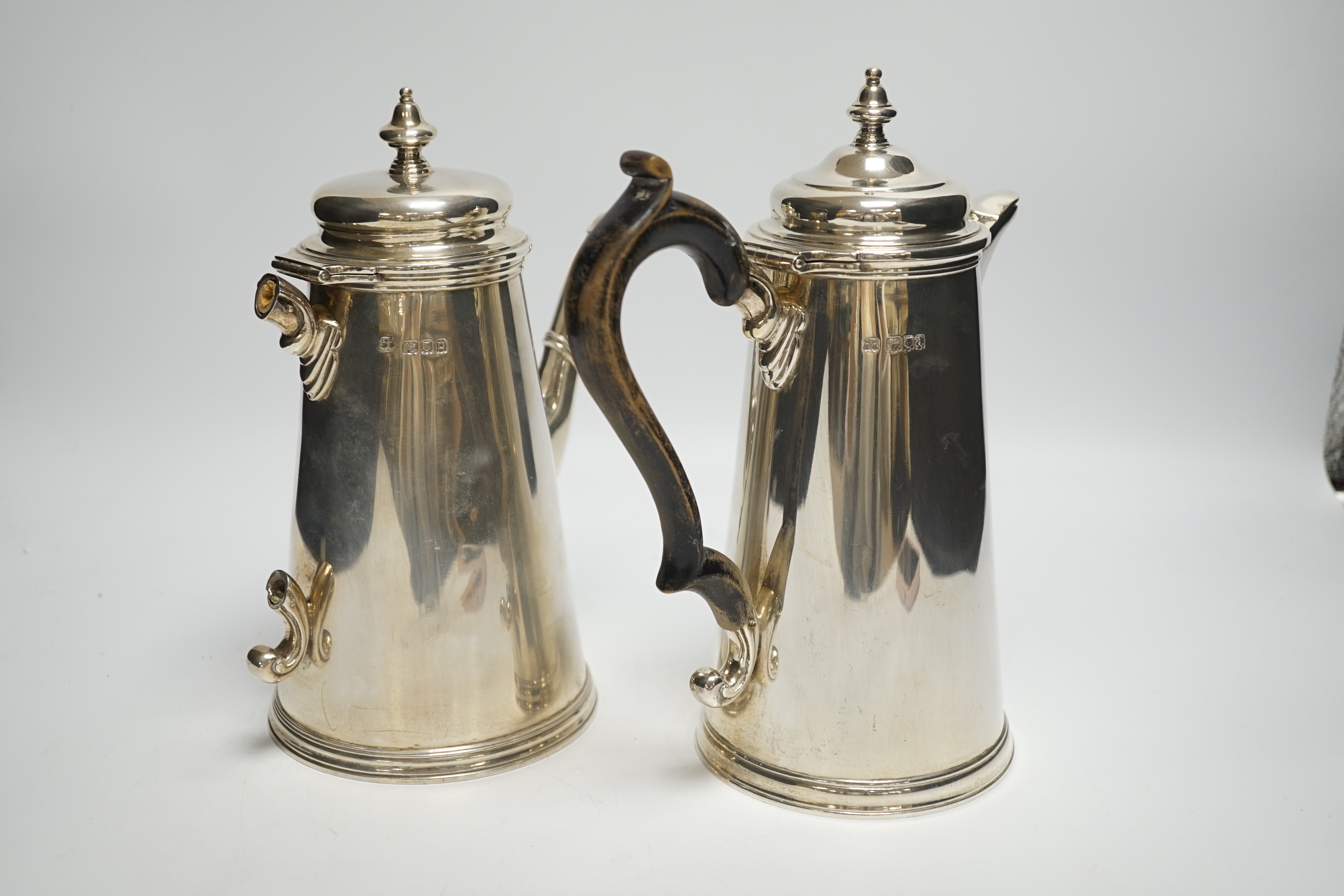 A pair of George V silver cafe au lait pots, Daniel & John Welby, London, 1916/18, handle missing, gross weight 54oz.